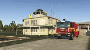 Duxford Airfield control building with a fire engine and ground staff in Microsoft Flight Simulator.